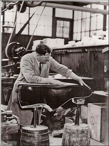 Photograph of employee working on a "Large" Demonstration Shoe