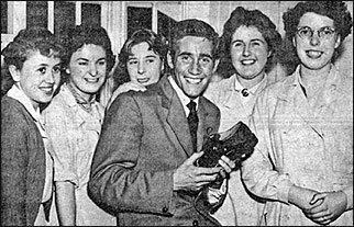 Photograph of Jim Dale, local pop and filmstar, in 1958 with workers
