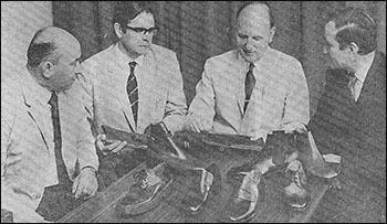 Mr Ted Reed, Mr John Matthews, Mr Angus Westley and Mr Walter Cornell examining some of the shoes produced