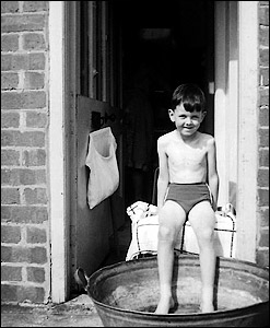 Cooling off on a hot day outside Millie West's front door 1963