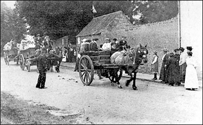 A Church procession with ‘Bibs’ Attfield in charge of the first farm wagon.