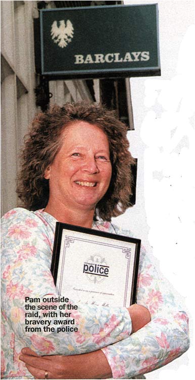 Photograph of Pam Mills with her bravery award from the police