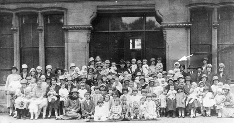 Photograph of mothers and children outside the Rectory.  Joan and her mother arrowed.