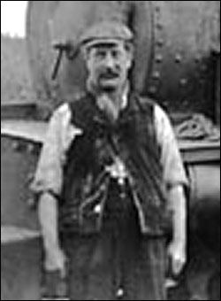 Photograph of Arthur W Hodson showing him as an engine driver employed by the Burton Ironstone Company living with his large family at Windmill Cottages