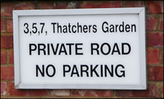 Sign to thatchers Garden