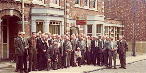Photograph taken outside the Club in the mid 1970s showing the older members about to embark on an outing.