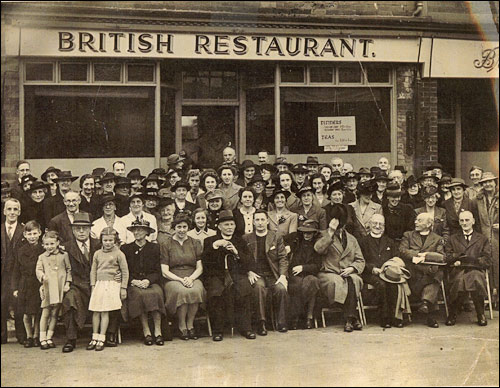 This photograph from 1944 shows a party from the Baptist Church seated outside the British Restaurant in Duke Street.