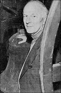 Photograph of Rev Edward Pitt with 335-year-old bell 