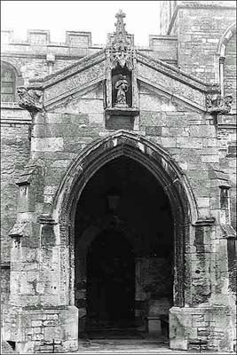 Photograph showing North Door with statue of Madonna and Child