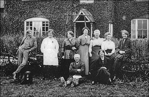 Photograph taken at the front of Buccleuch Farmhouse showing Mr Pike, (farmworker) Louisa Downing, Polly Downing, Alice Downing, Nell Downing, Fred Downing, Rosa Downing