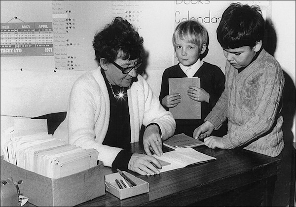 Mrs Williams with two children in her class in about 1971