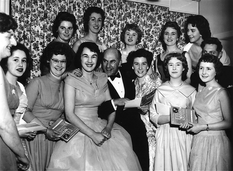 50 years Anniversary Celebration at Wicksteed Park showing Office Staff with the radio entertainer, Kenneth Horne