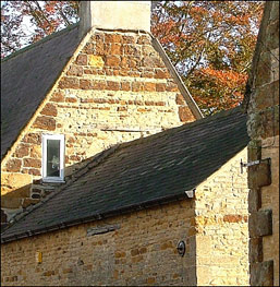 End wall of house in Church Street, showing the mix of limestone and ironstone used in the construction.