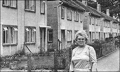 Photograph of Councillor Marian York in front of the Orlit houses