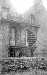 Spiral staircase on side of Cottage Homes