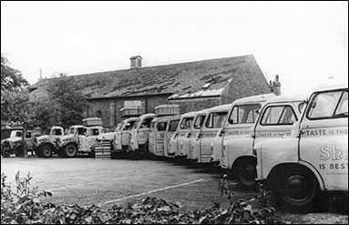 Photograph of She Products' fleet of delivery vehicles taken in 1963.