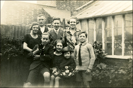 Annie Potter with her family and two of the London children - 1927