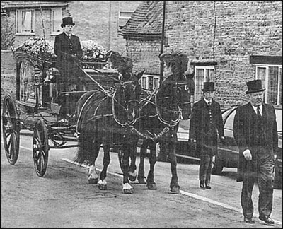 Funeral procession of Robin Attfield with 1904 hearse drawn by two Belgian horses.
