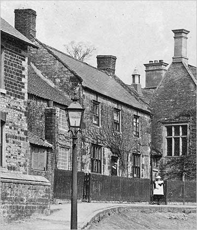 This photograph, taken circa 1910, shows Talbutt's bakehouse next to the Jacobean schoolhouse. The building was demolished c.1969.