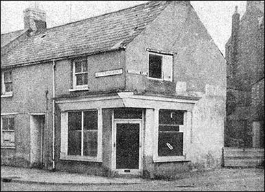 Photograph showing the corner shop as it was before the "face lift"