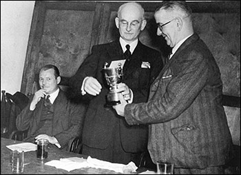 Photograph  of an award presentation at The Conservative Club, possibly taken 1951-2, event unknown.