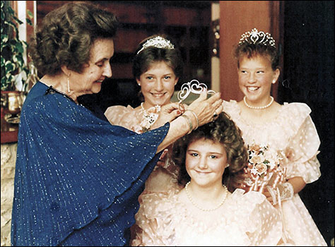 1987 Princess Tania Theobald being crowned by Megan White. The attendants are Louisa Haynes and Laura Newcombe
