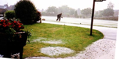 9 July 1993 Flooded Bowling Green - Robert Gater (Greenkeeper) collecting woods after a thunderstorm