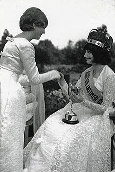 1964 Queen, Sheila Ellson, accepting a cup from 1963 Queen E. Bailey