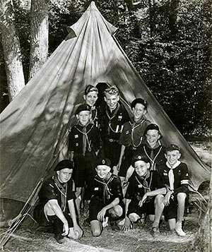 A group outside their tent