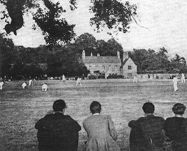 Photo Burton Latimer Cricket Ground at the Hall Field and Burton Latimer Hall in background