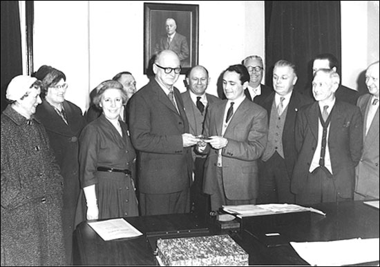  Cllr A F Mutlow centre and rear of the photograph showing presentation on the retirement of Mr G C Borman as Surveyor & Public Health Inspector to the Burton Latimer Urban District Council 