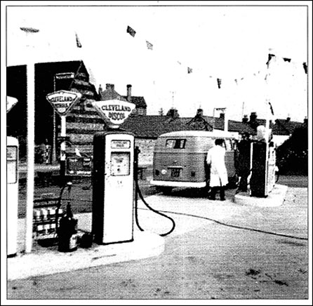 Photograph showing Jack Craddock at the pumps of Kettering Road Filling Station for Church Street Autos