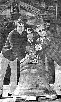Derek Fleckney, Barry Thompson and David Trehearn manhandle the cracked bell which is to be repaired